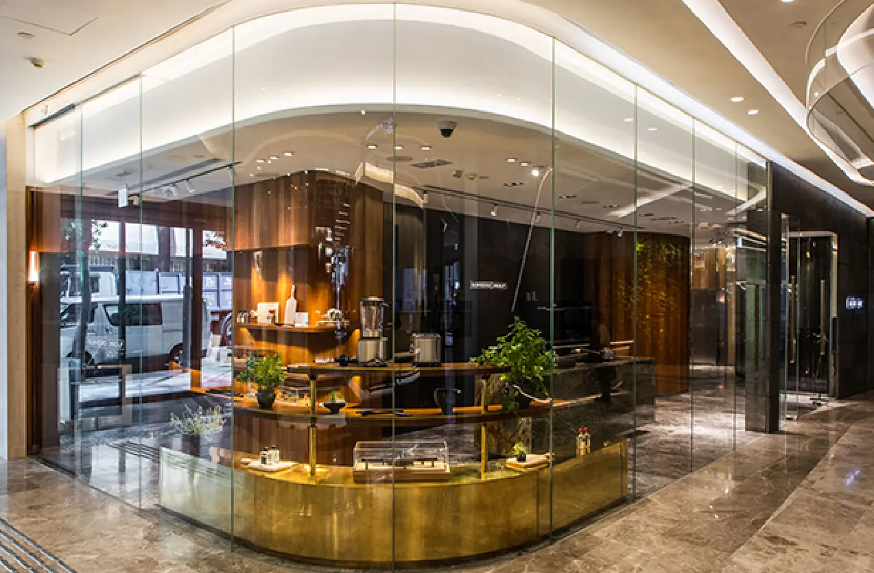 glass wall showcasing Sub-Zero and Wolf's kitchen appliances