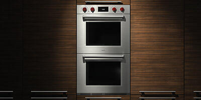 classy oven with red knobs