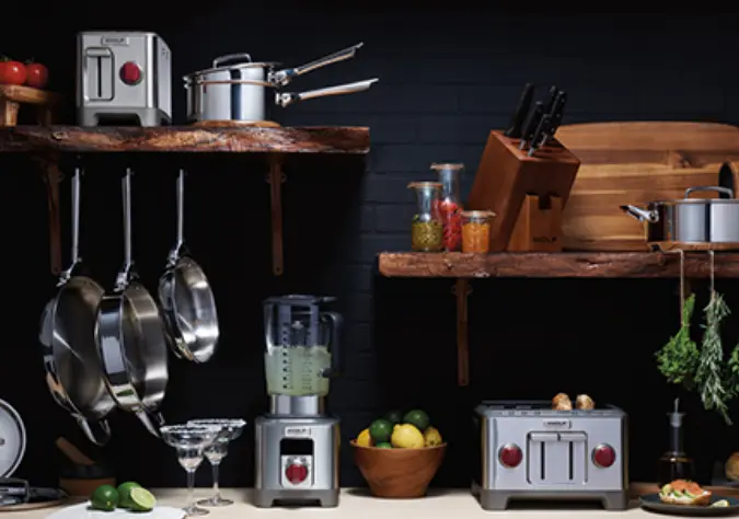a collection of cookware, mixers, blenders and toasters